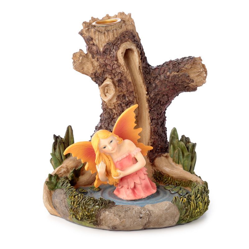 Intricate resin backflow incense burner featuring a fairy by a lake nestled within an ancient tree trunk.