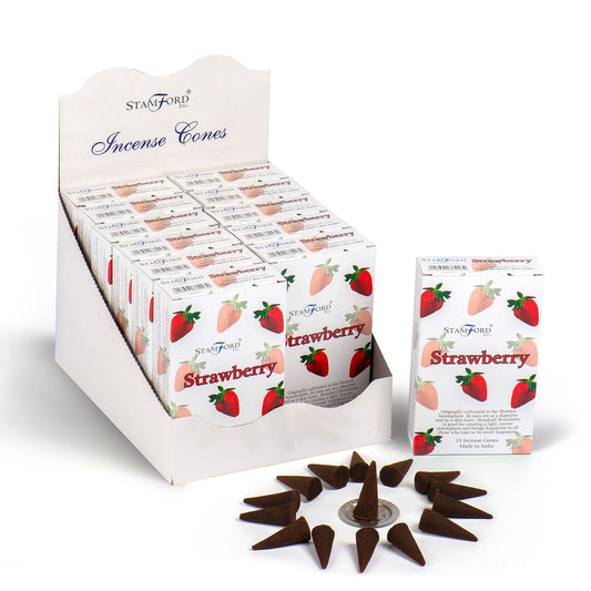 A pile of red incense cones with a sweet strawberry fragrance on a neutral background.