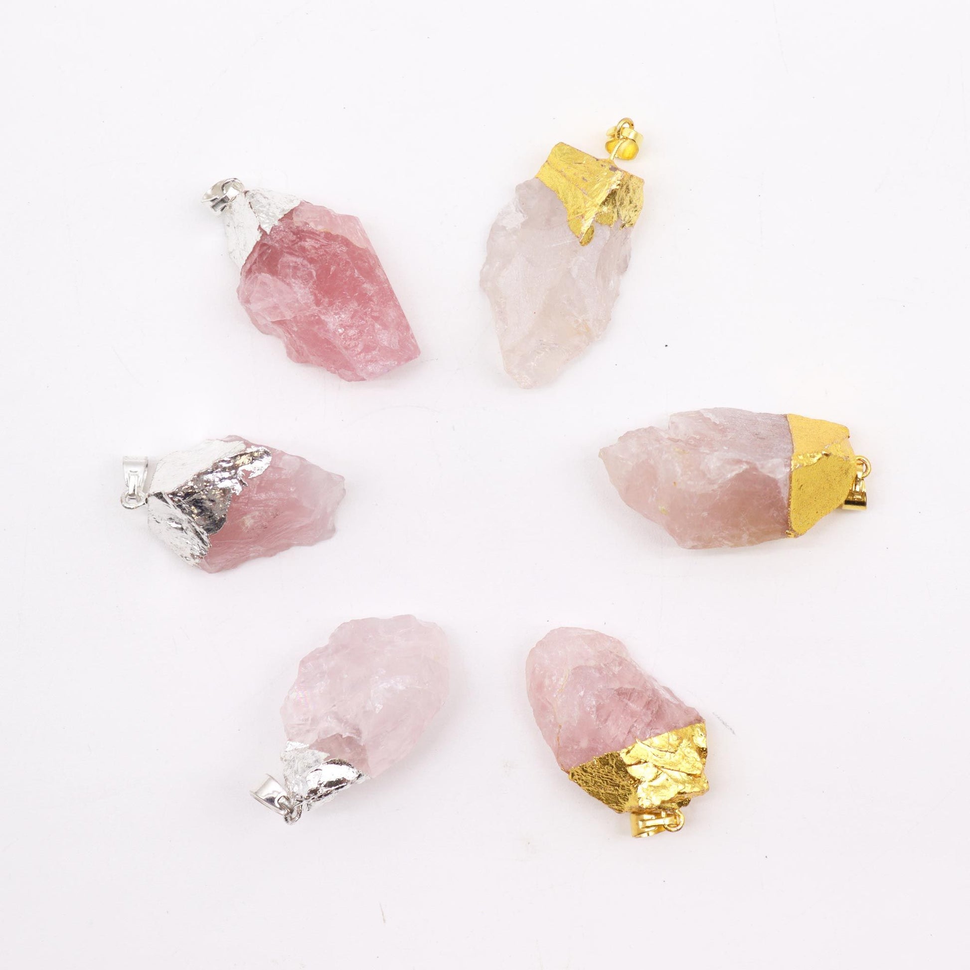 Six assorted polished rose quartz gemstone pendants with elegant gold and silver plated bail settings.
