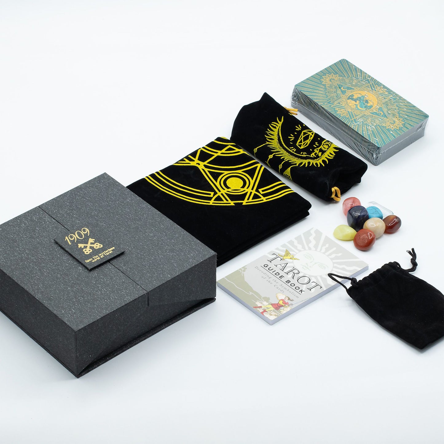 Luxurious tarot card deck featuring intricate gold and turquoise foil designs on high-quality cards in a matching gift box.