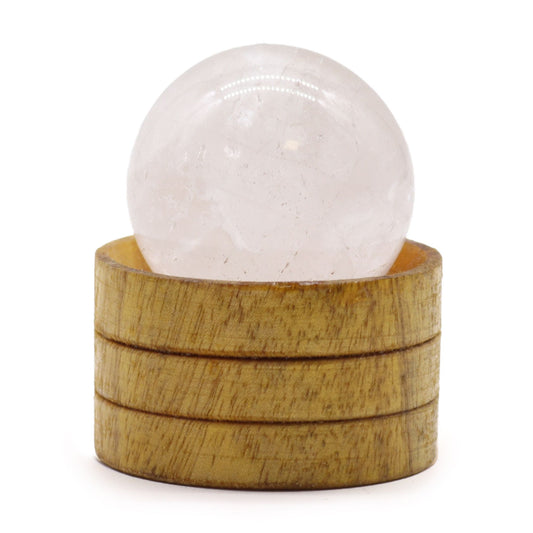 A polished 40mm clear quartz crystal sphere resting on a small wooden display stand.