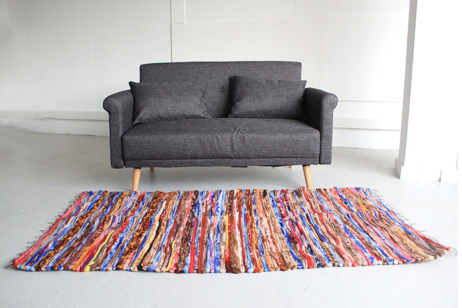 Vibrant hand-woven large velvet Indian rag rug made from recycled colourful textiles.