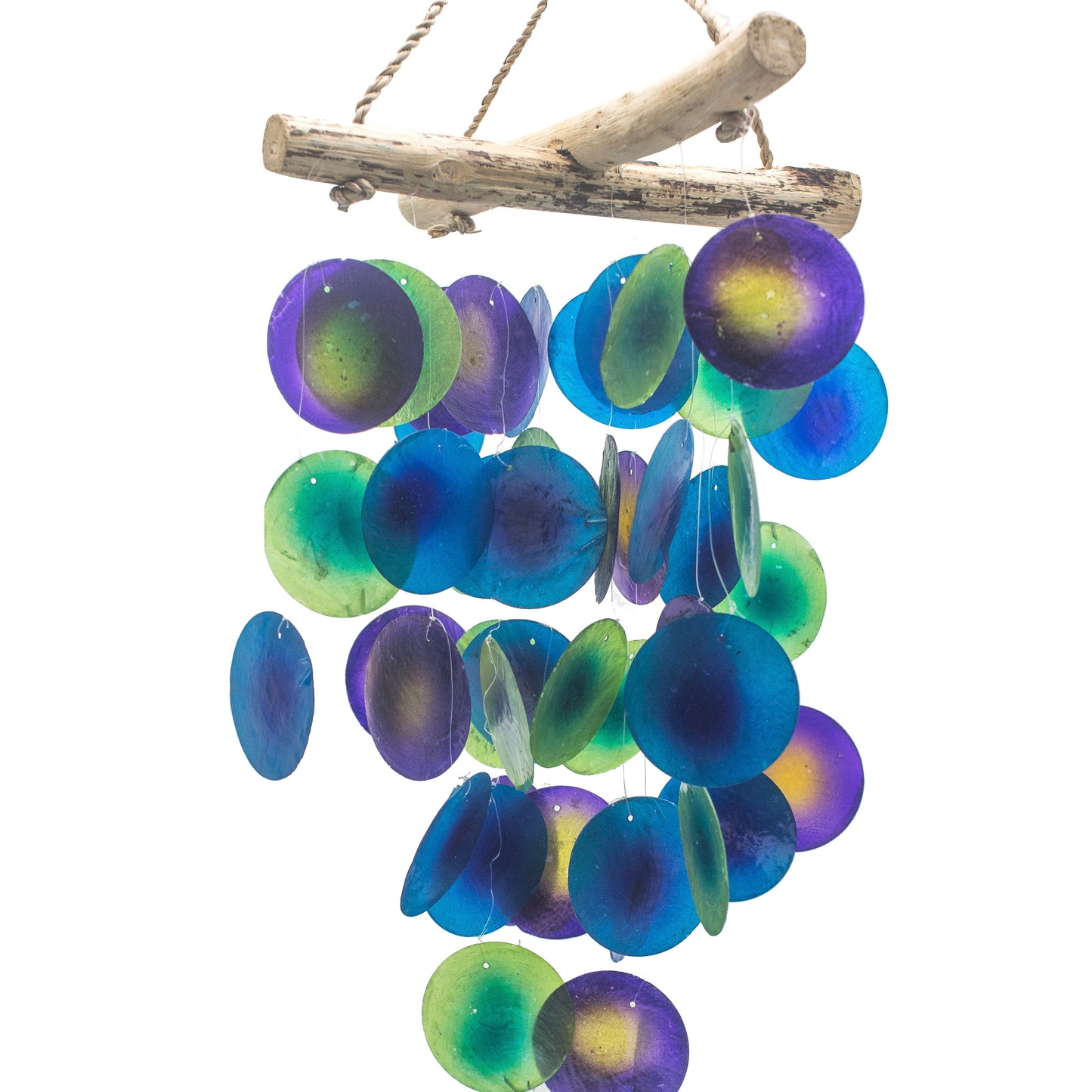 Handcrafted driftwood wind chime with a cross design featuring vibrant green and purple Capiz shells.