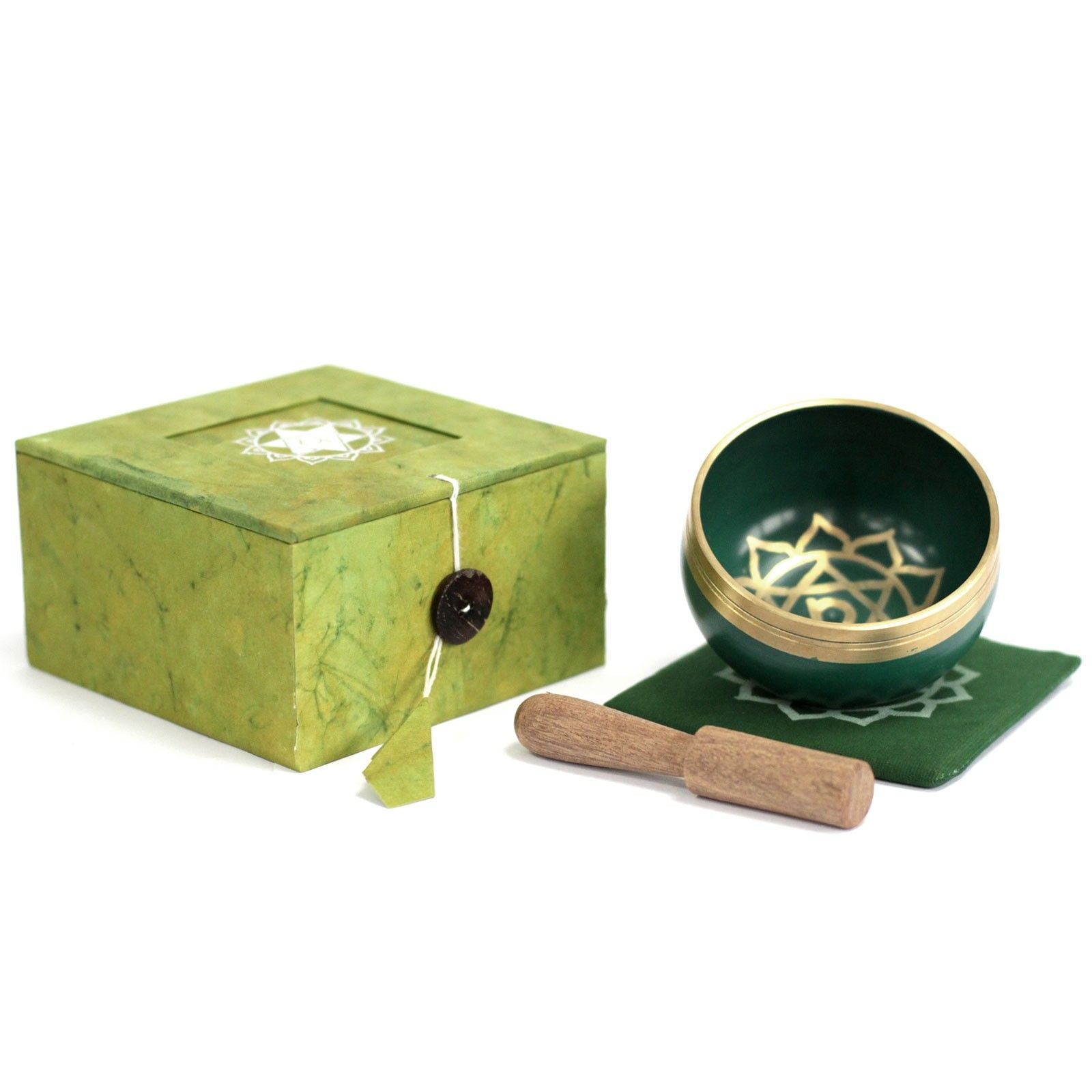 Handcrafted green Heart Chakra singing bowl with sacred symbols and a wooden striker for meditation.