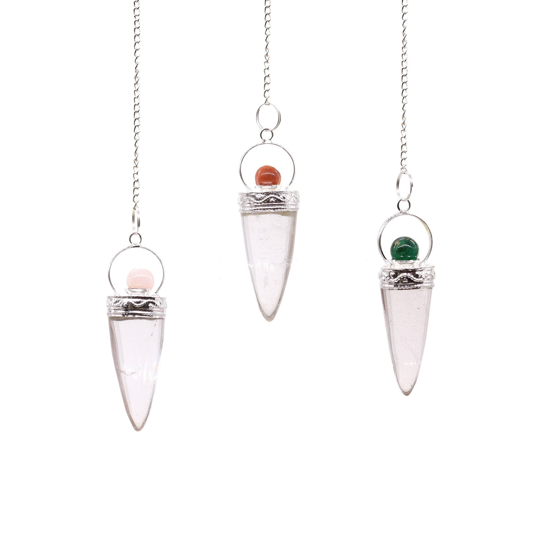 Clear rock crystal cone-shaped pendulum hanging from a delicate silver chain with a silver ring detail.