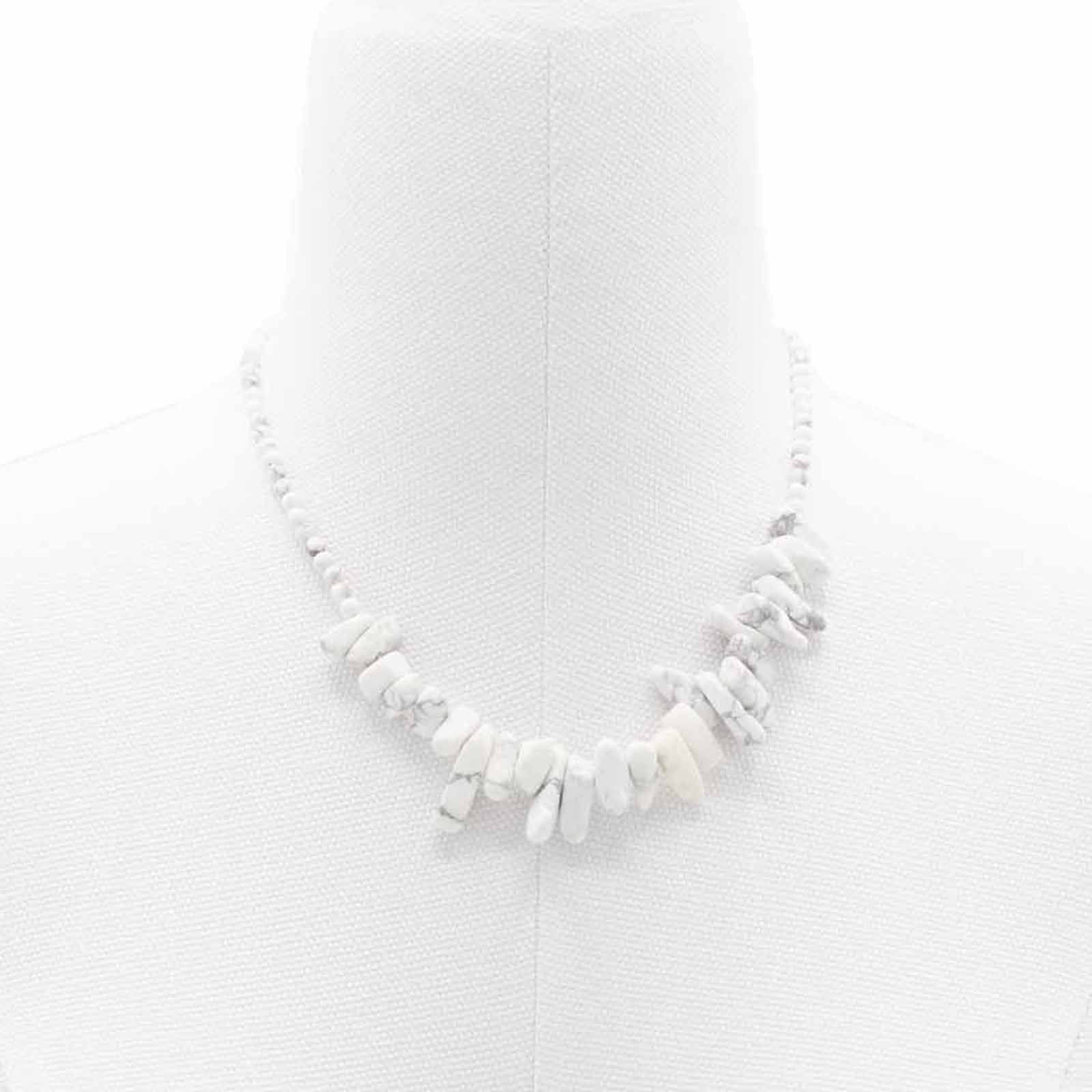Elegant silver-toned necklace featuring smooth, polished white jasper gemstones with a natural marbled texture.