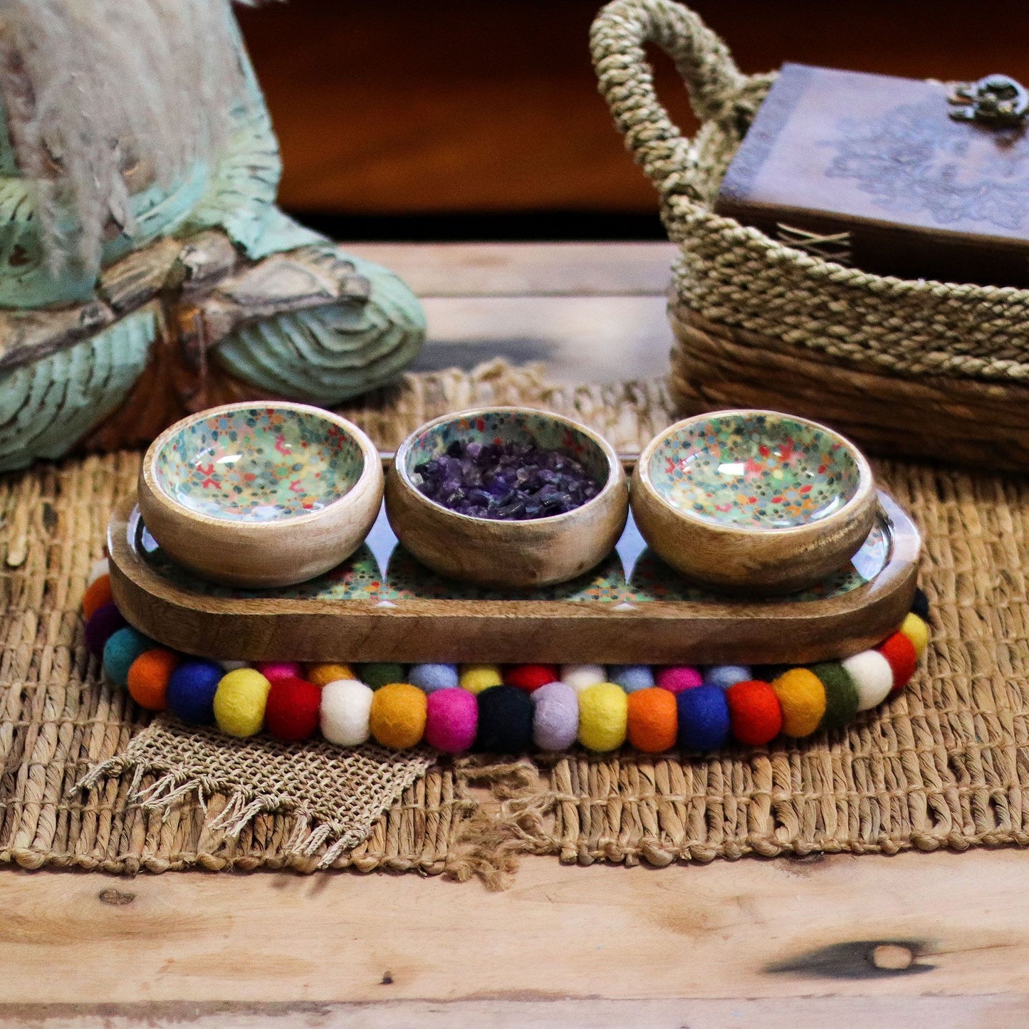 Handmade oval centre mat featuring a vibrant array of multi-coloured felt balls in a textured, bohemian design.