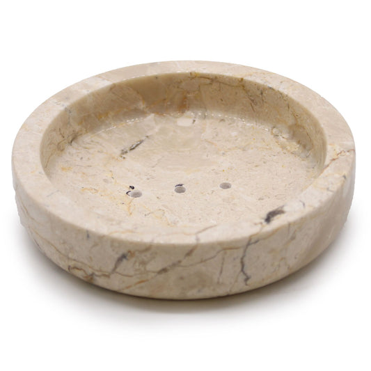 Hand-crafted round flat soap dish made from polished honey-toned marble with natural veining.