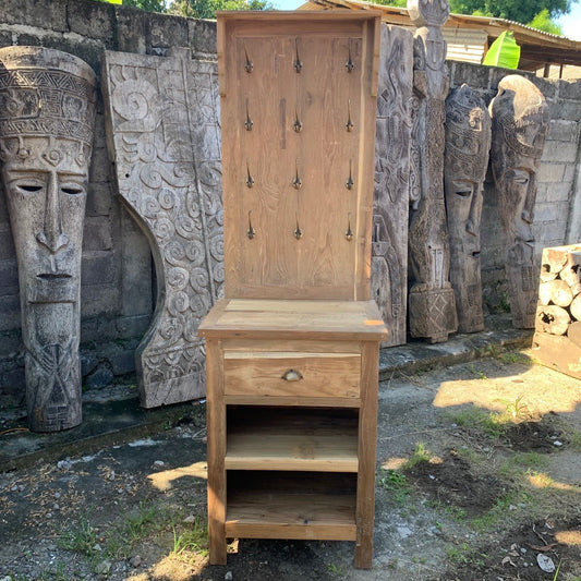 Rustic recycled wood display stand with multiple metal hooks and a small storage shelf for home decor.