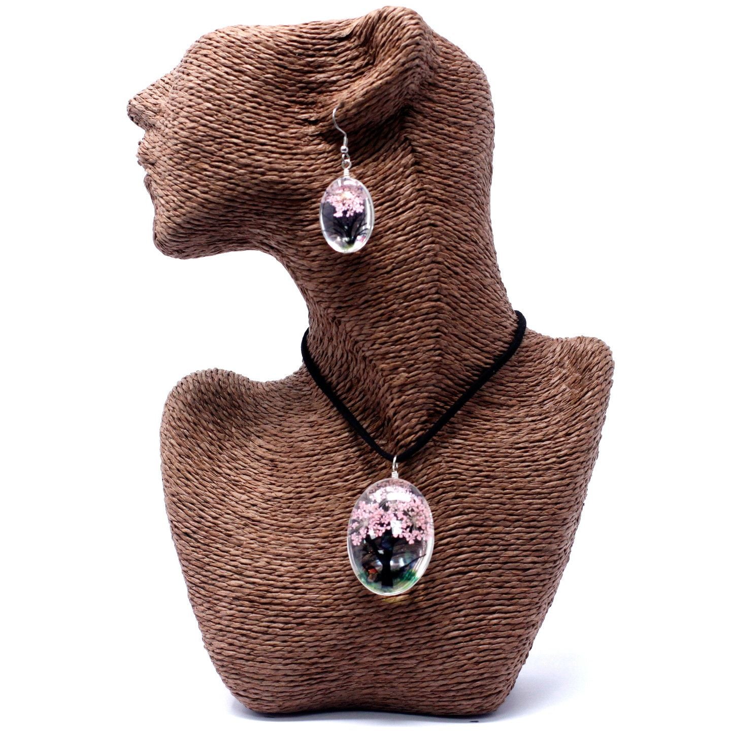 Delicate silver-tone necklace and earring set featuring pink real pressed flowers within a Tree of Life glass pendant.