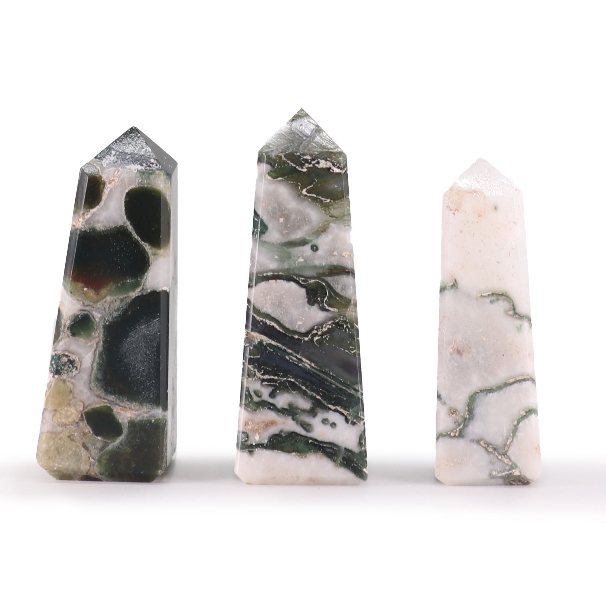 Small polished Moss Agate gemstone obelisk point with natural green and white earthy patterns.