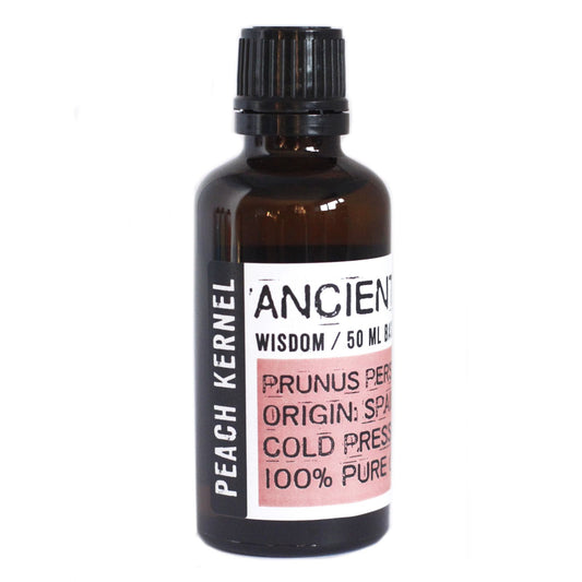 Clear light yellow peach kernel oil in a 50ml amber glass bottle with a black screw cap on a white background.