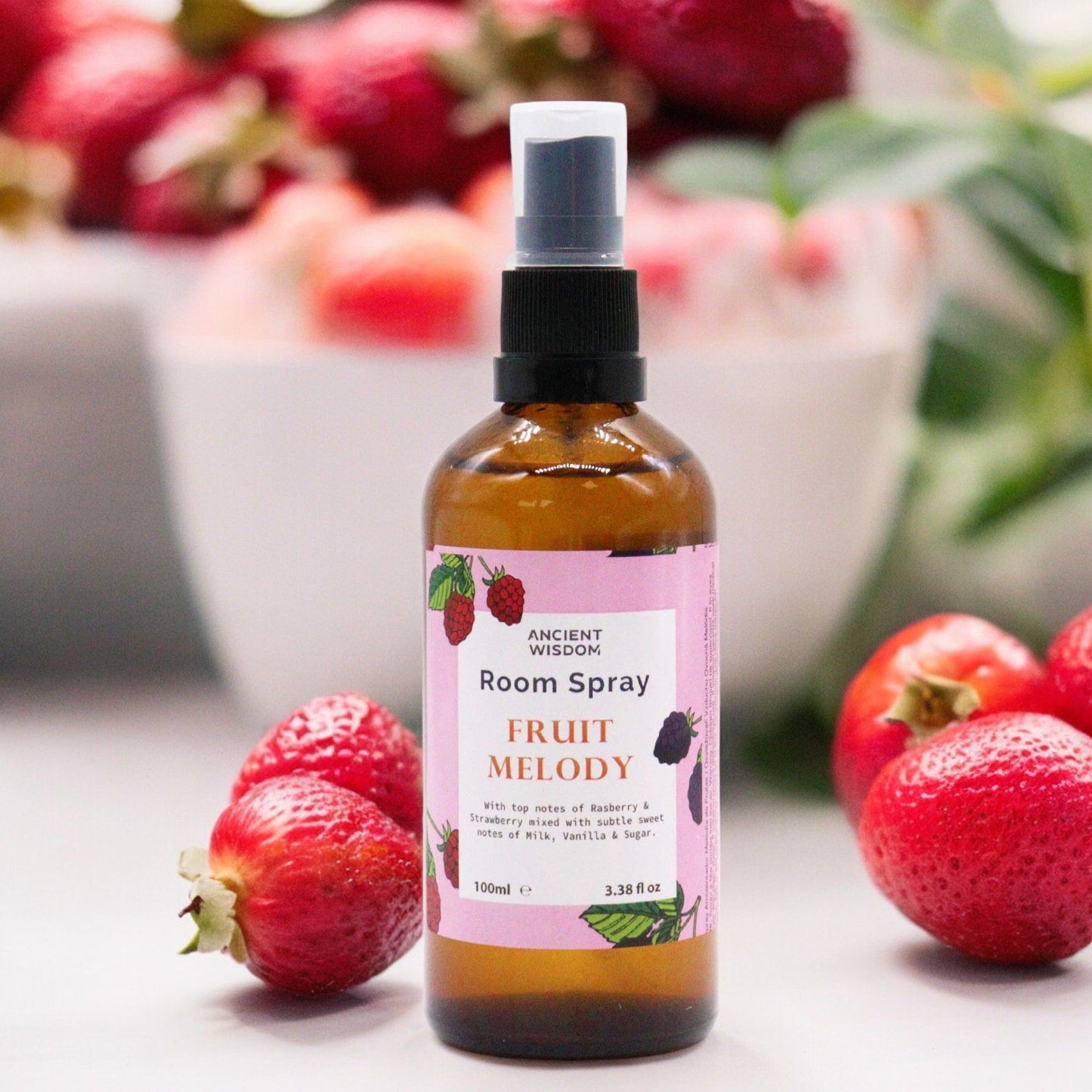 Clear 100ml bottle of Fruity Melody room spray featuring a refreshing berry scent for home fragrance.