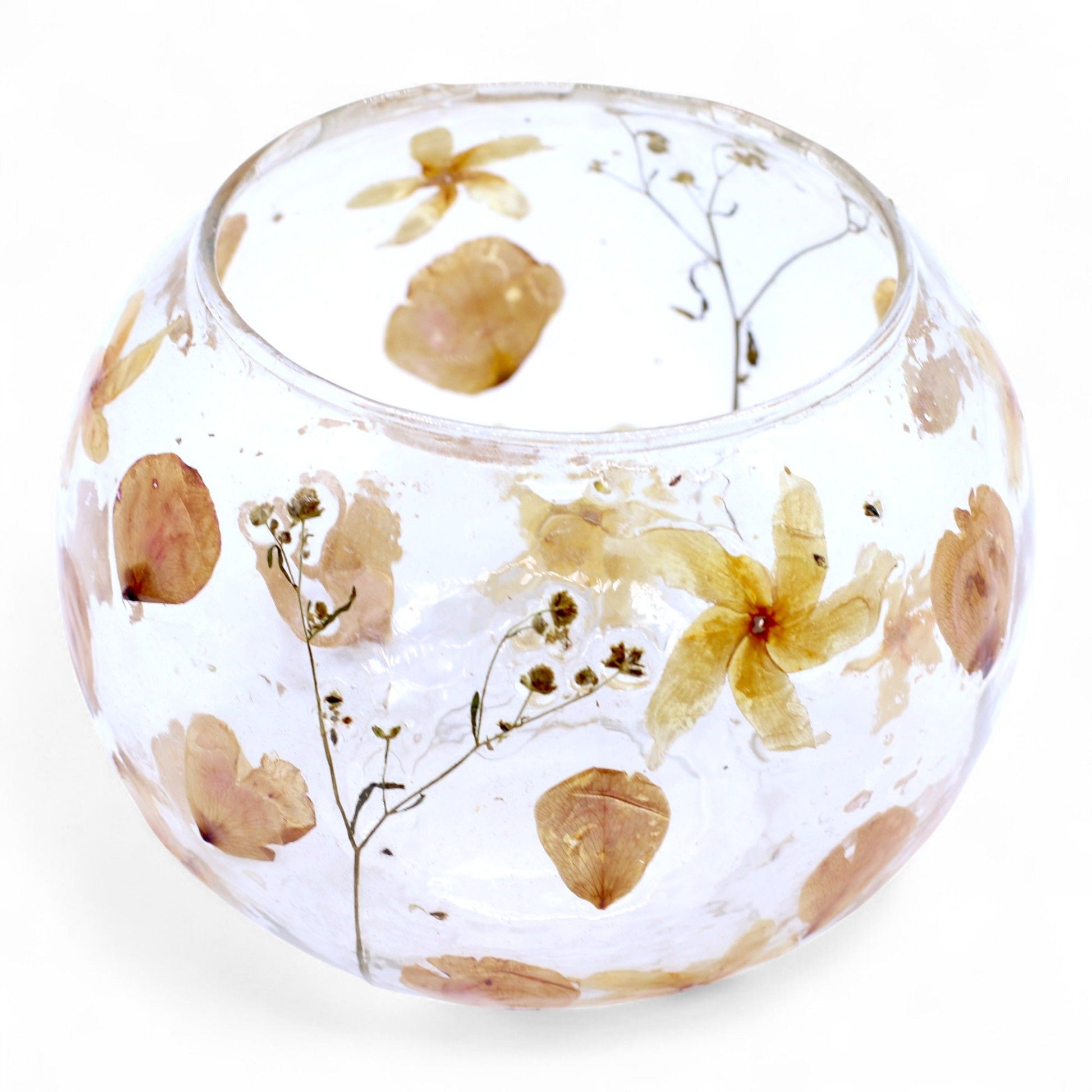 Large bowl candle holder made of recycled glass with delicate real pressed pink flowers and petals encased inside.