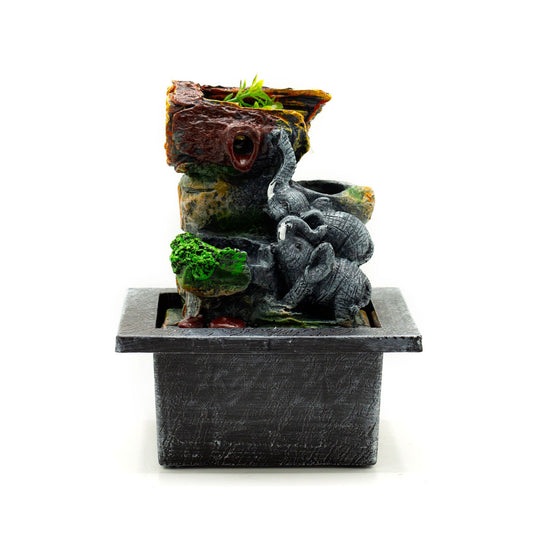 Detailed grey resin tabletop water feature featuring two sculpted elephants entwined in a loving pose.