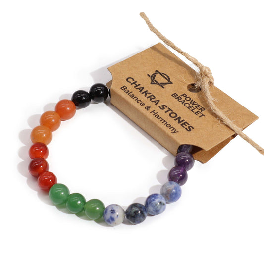Elasticated power bracelet featuring seven different colourful natural gemstone beads representing the body's chakras.