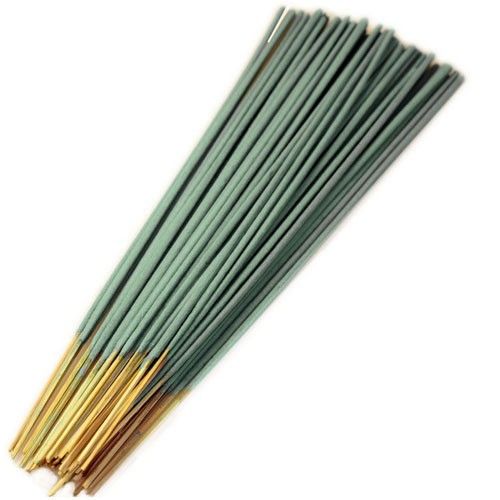 Large bundle of traditional Nag Champa incense sticks showing their characteristic textured brown coating.