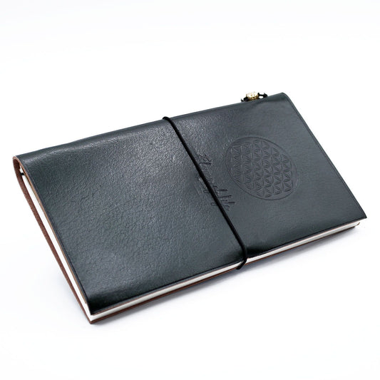 Handmade green leather journal with an embossed Flower of Life design and a wrap-around leather strap.