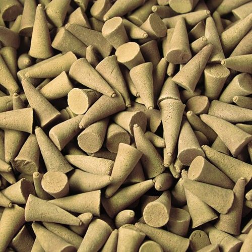 A large collection of dark brown incense cones with a smooth texture, perfect for home fragrancing.
