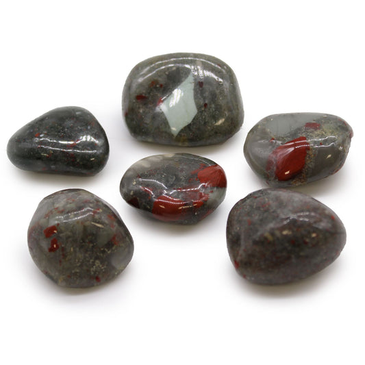 Large polished green African Bloodstone tumble stones with deep red jasper inclusions and a smooth finish.
