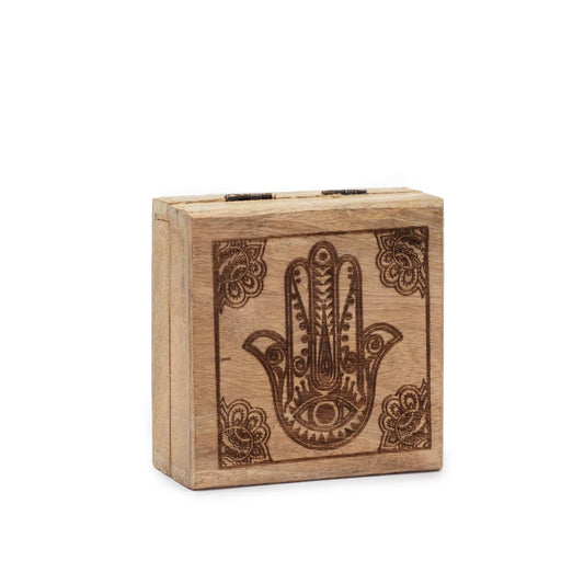 Small square black wooden box with a detailed Hamsa hand symbol engraved on the lid.