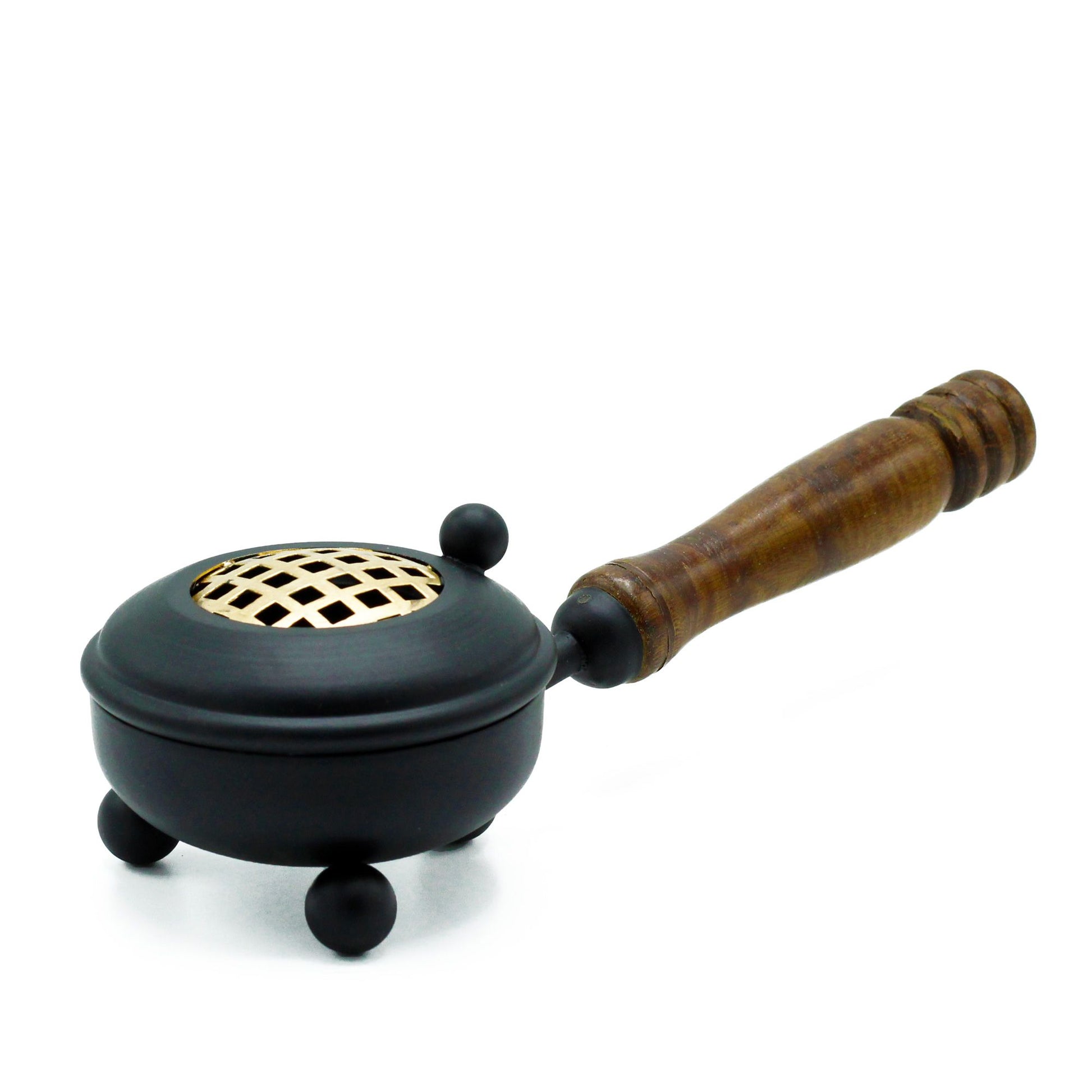 Rustic black cast-iron incense burner with gold detailing and a practical wooden handle for burning cones and sticks.