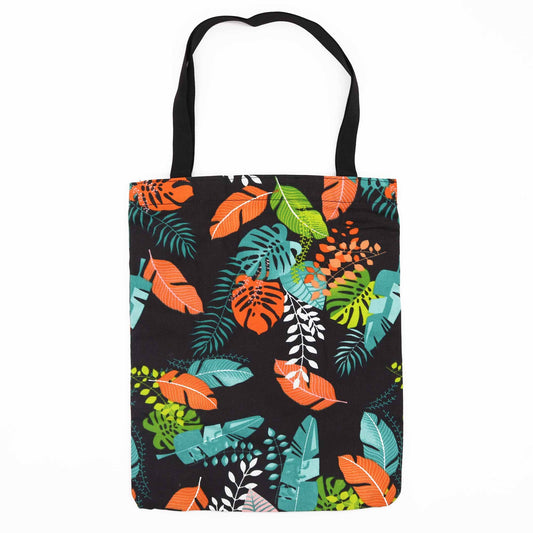Classic tote bag with a dark tropical botanical motif featuring lush green leaves on a dark background and a top zipper.