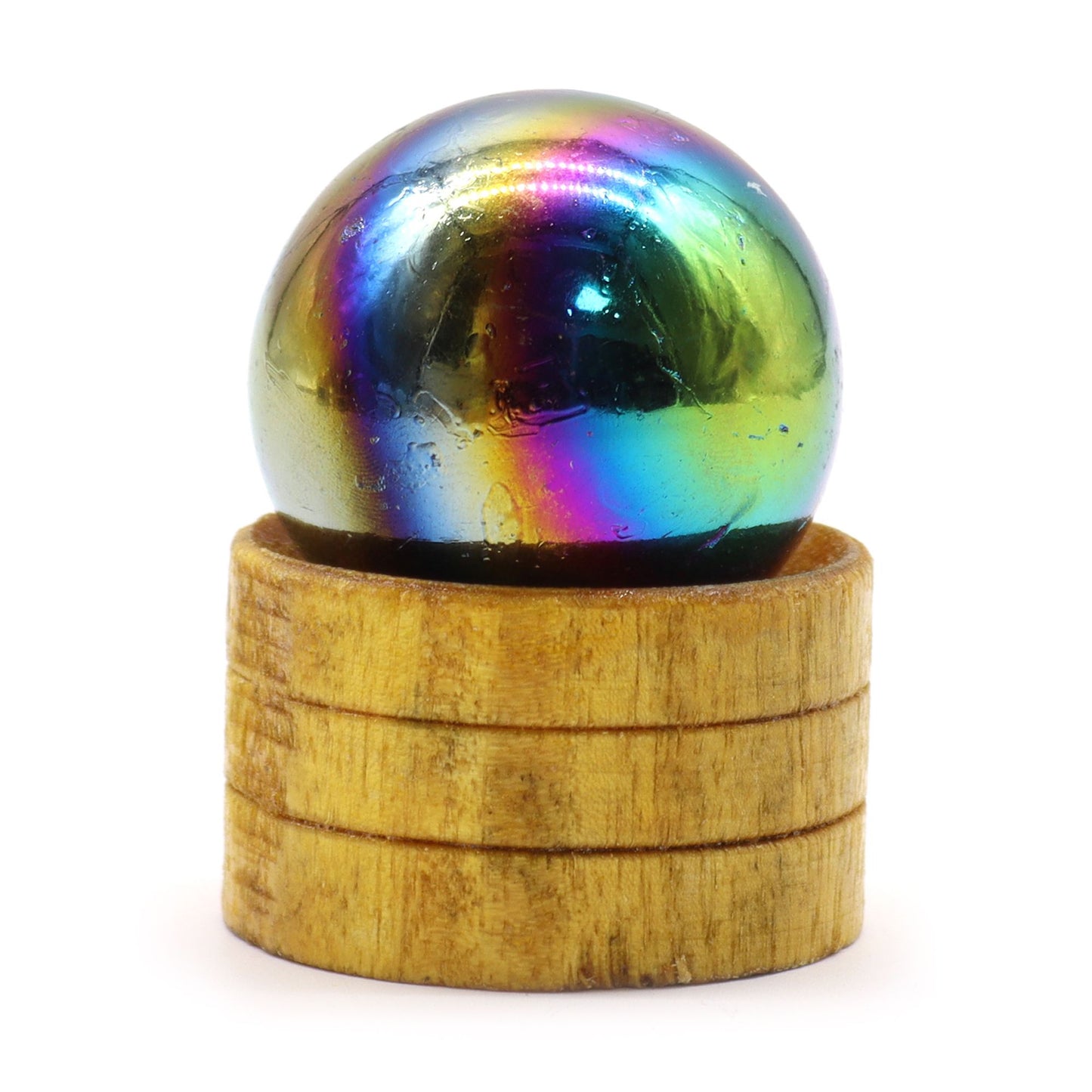 Shimmering purple Amethyst Aura gemstone sphere resting on a small elegant stand.