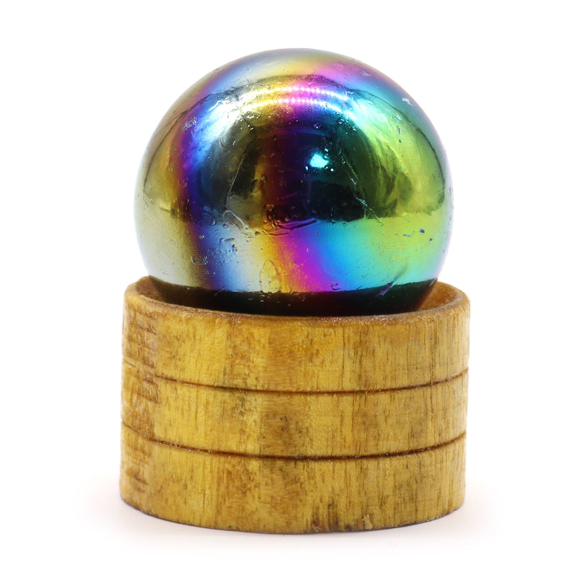 Shimmering purple Amethyst Aura gemstone sphere resting on a small elegant stand.