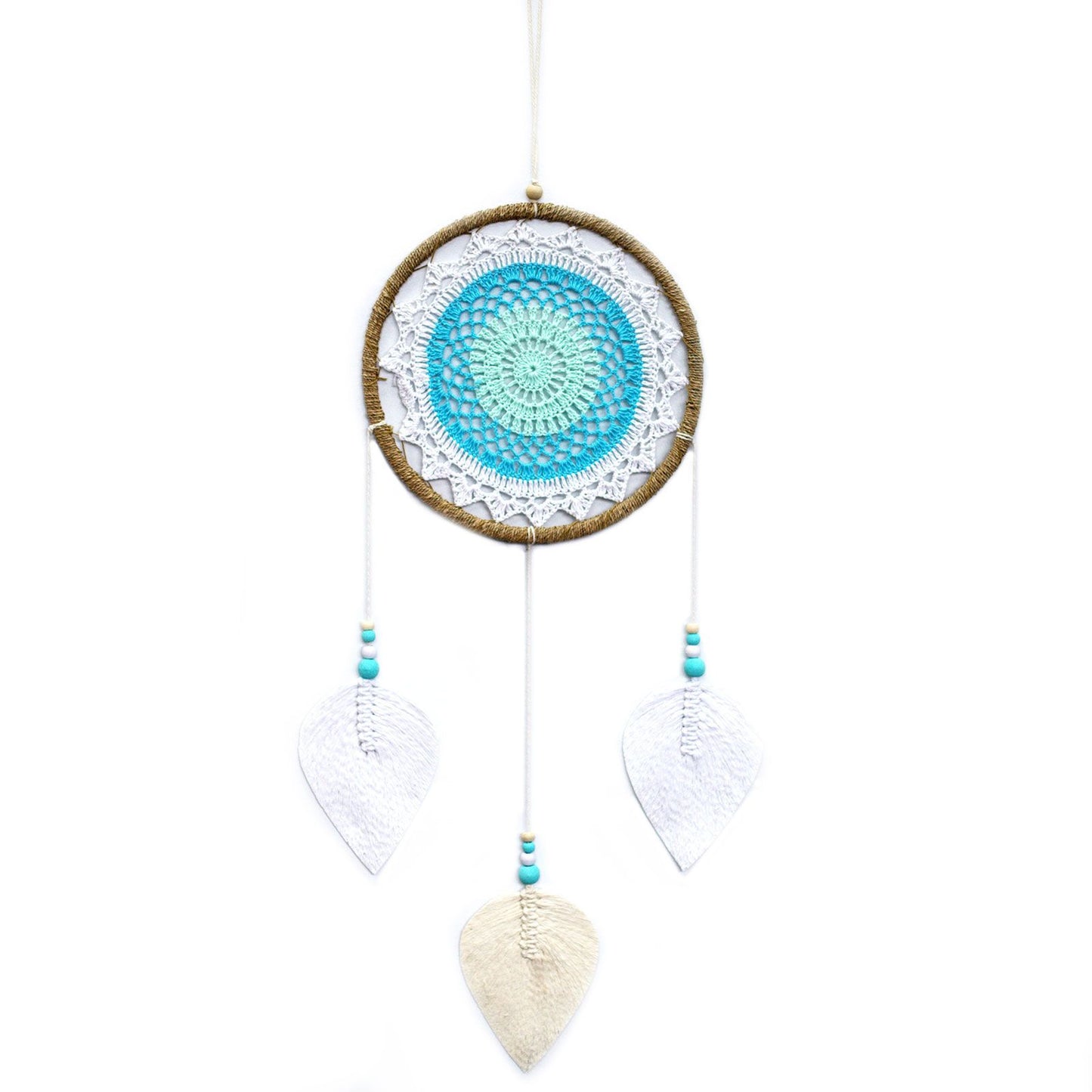 Large turquoise dream catcher with an intricate woven web and natural hanging elements without feathers.