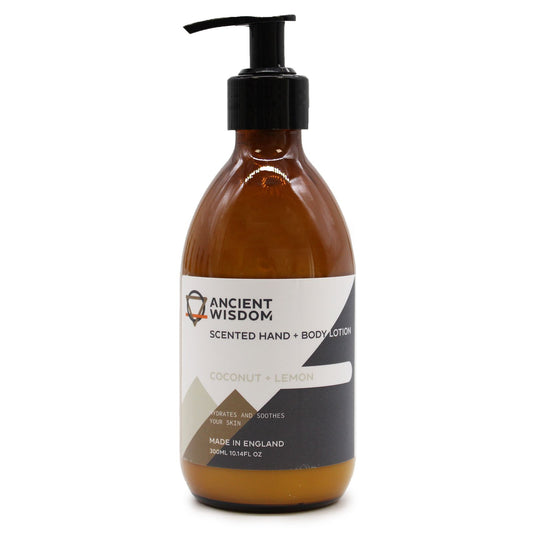Bottle of white hand and body lotion featuring a botanical label with coconut and lemon illustrations.