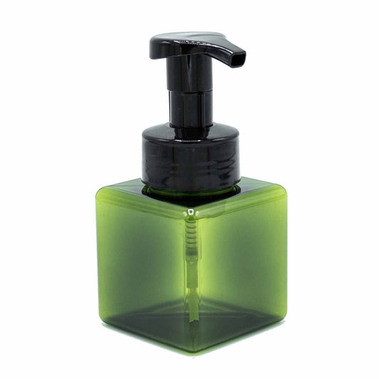 Compact green translucent plastic squat foam dispenser bottle with a white pump top for eco-friendly home use.