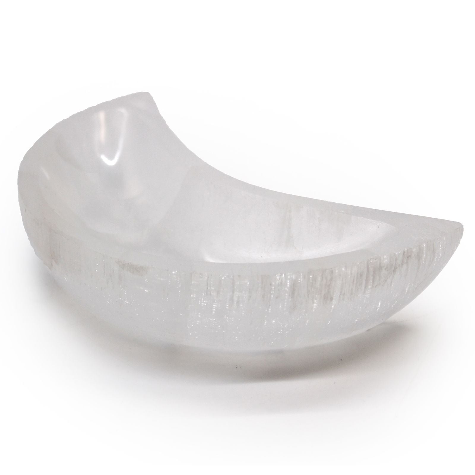 Large crescent moon shaped white selenite crystal bowl with a smooth polished finish and luminous glow.