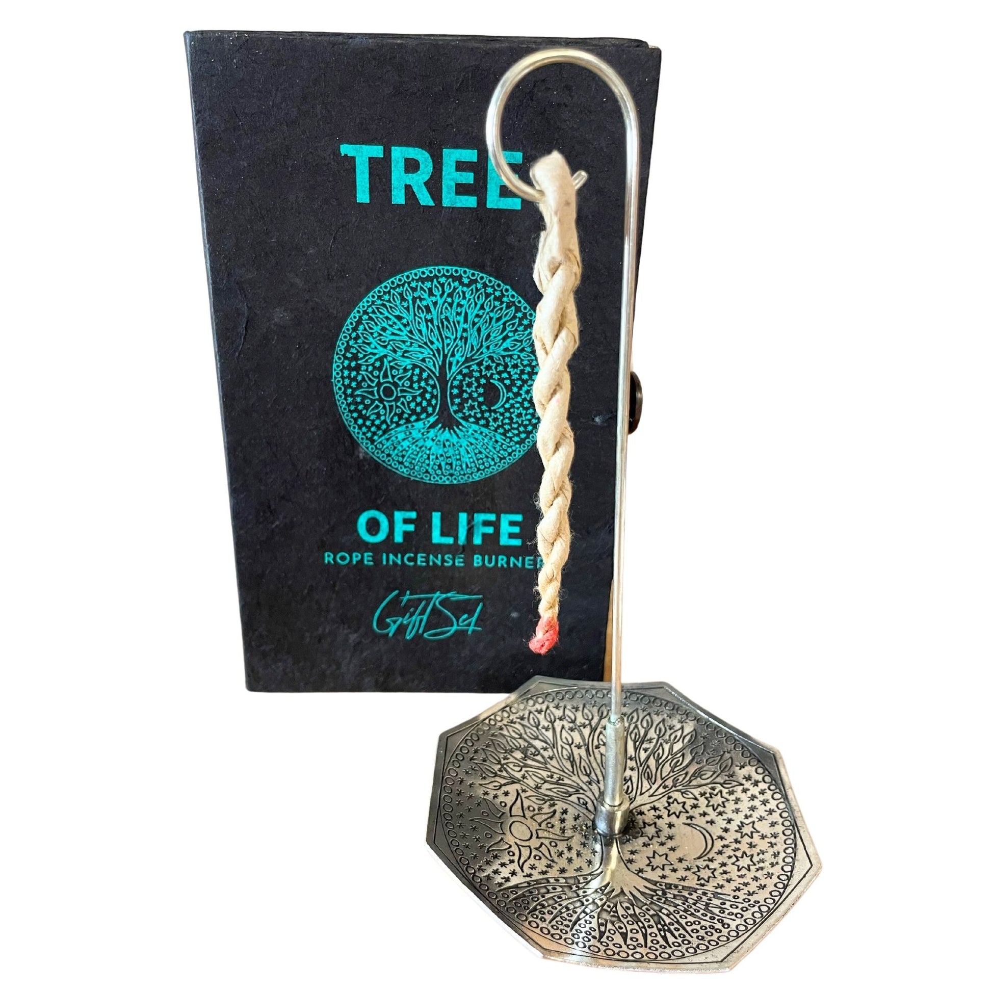 Hand-rolled rope incense bundles alongside a silver-plated burner featuring a detailed Tree of Life engraving.
