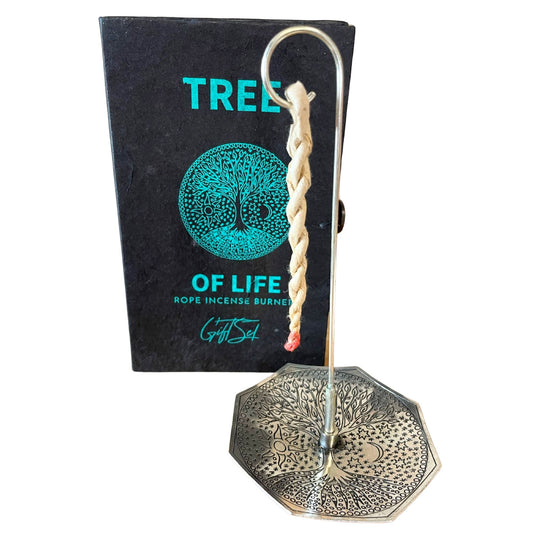 Hand-rolled rope incense bundles alongside a silver-plated burner featuring a detailed Tree of Life engraving.