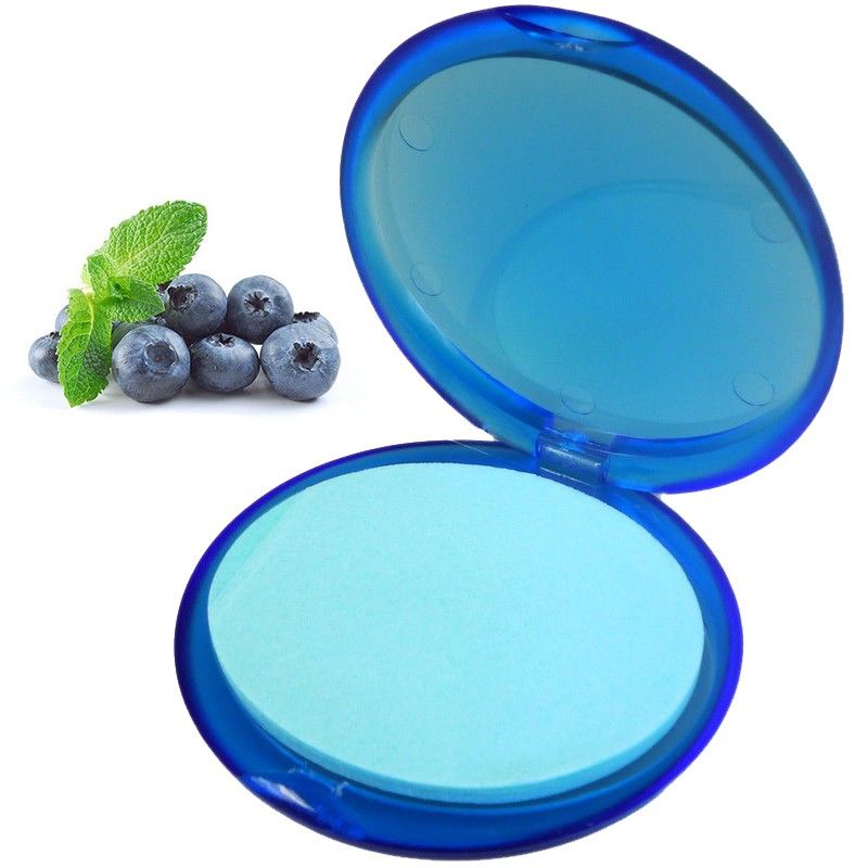 Small portable container filled with thin, circular blue paper soap sheets scented with blueberry.