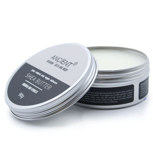 A 90g tin of smooth, creamy ivory-coloured shea body butter on a neutral background.