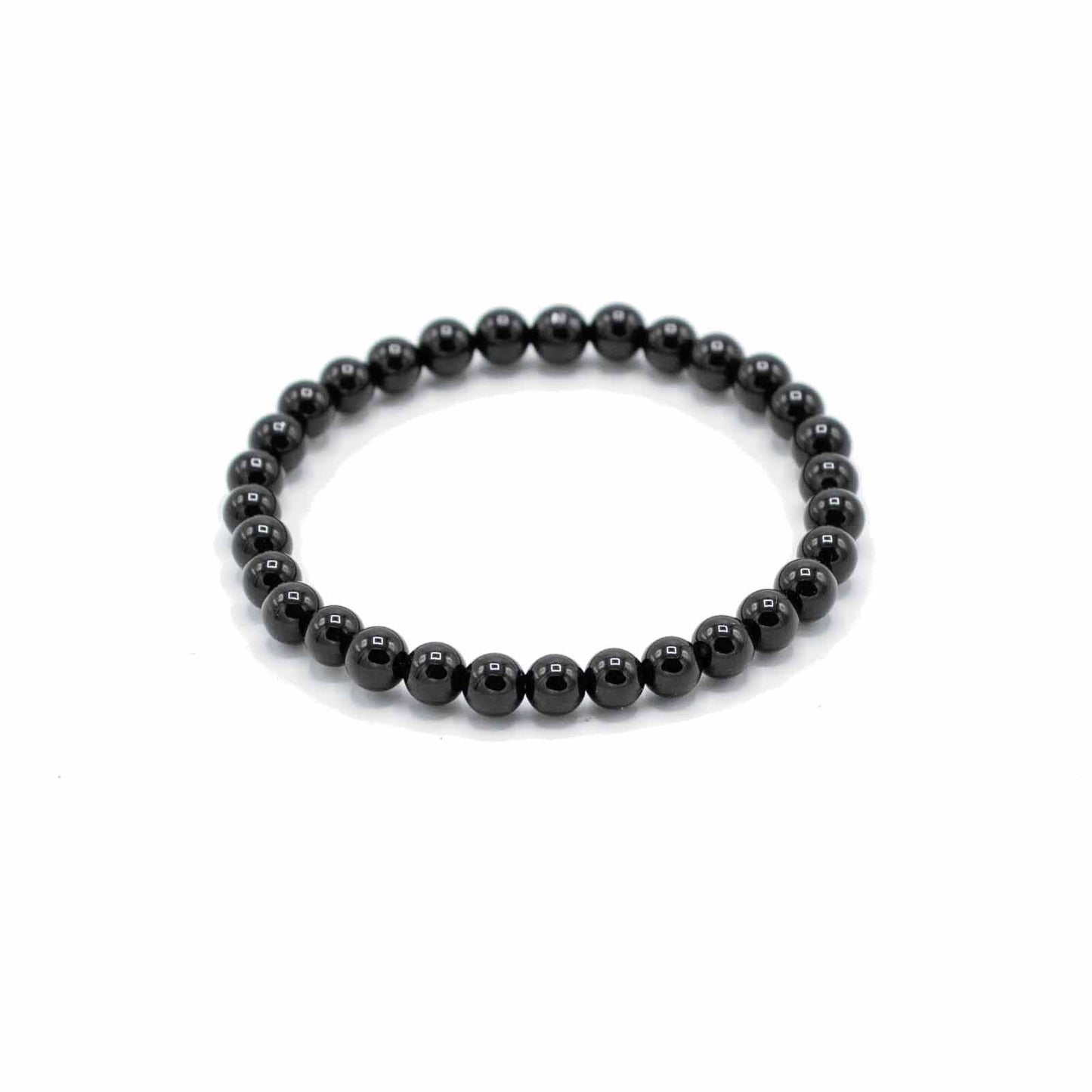 Handcrafted gemstone bracelet featuring smooth, polished black agate beads on an elasticated cord.