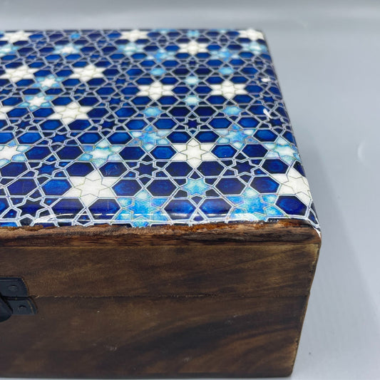 Large wooden keepsake box with a blue ceramic lid featuring white and yellow star patterns.