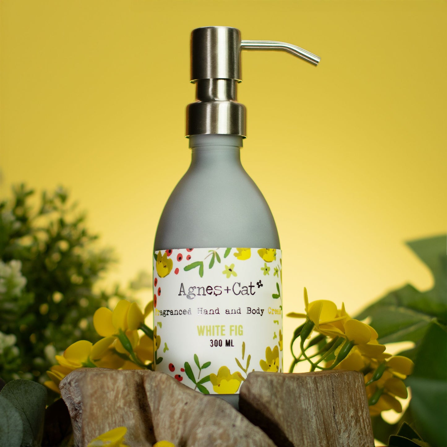 Close-up of a white hand and body cream with a smooth, creamy texture on a neutral background.