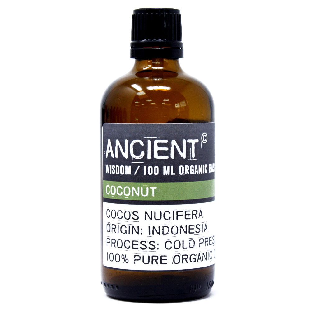 Clear glass bottle of organic coconut base oil showing its natural solid white texture at room temperature.