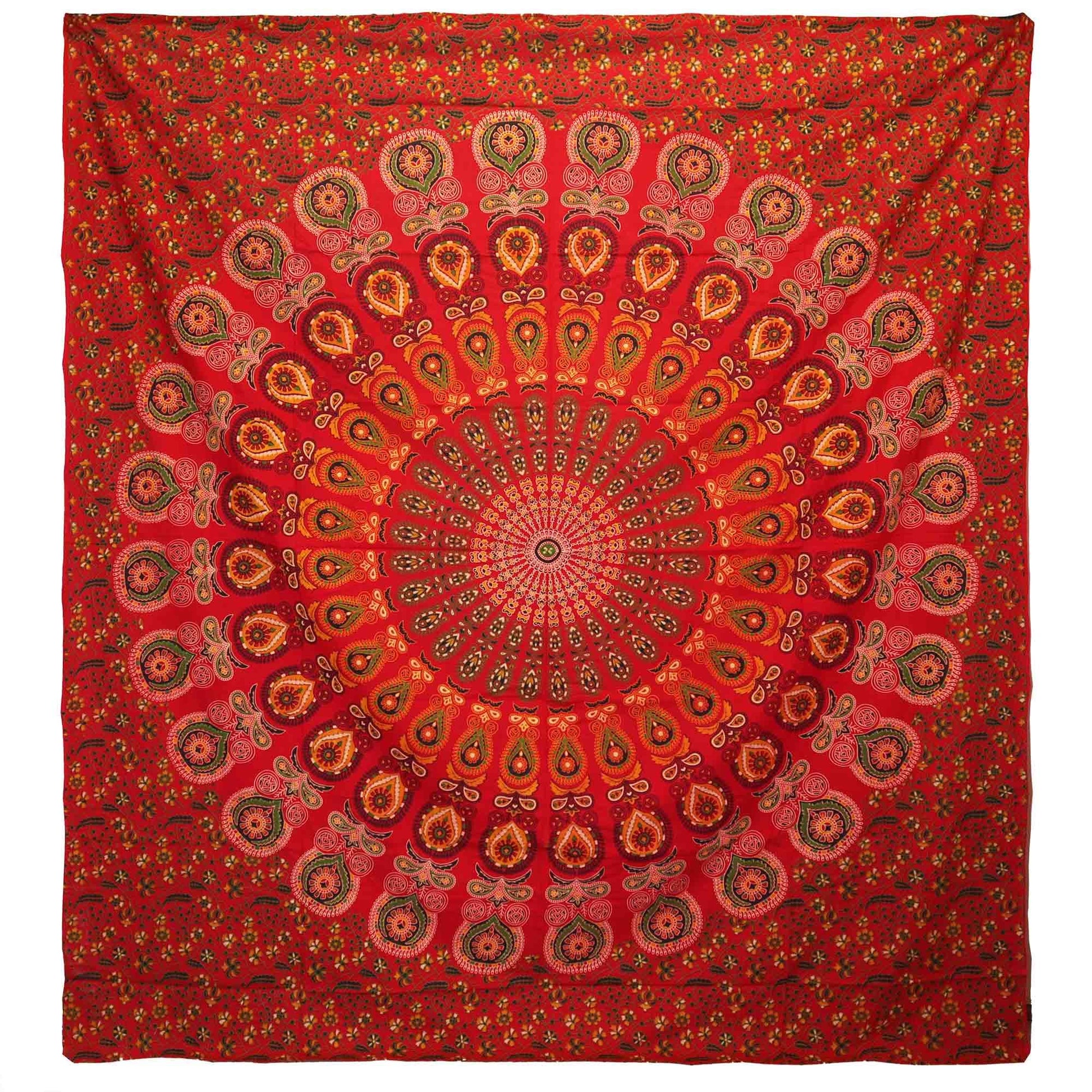 Large red cotton bedspread featuring a detailed white peacock mandala design, displayed as a decorative wall hanging.