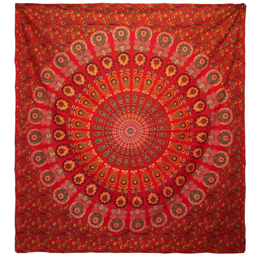 Large red cotton bedspread featuring a detailed white peacock mandala design, displayed as a decorative wall hanging.