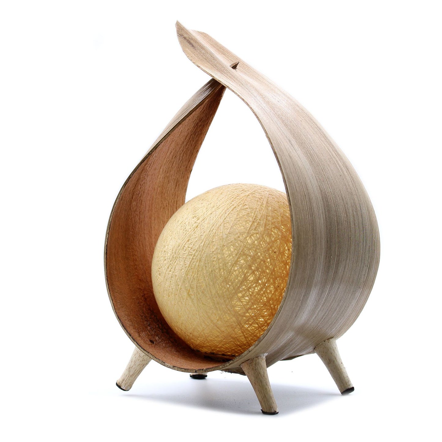 Handcrafted coconut leaf table lamp with a natural wrapover design and a warm white spherical cotton shade.