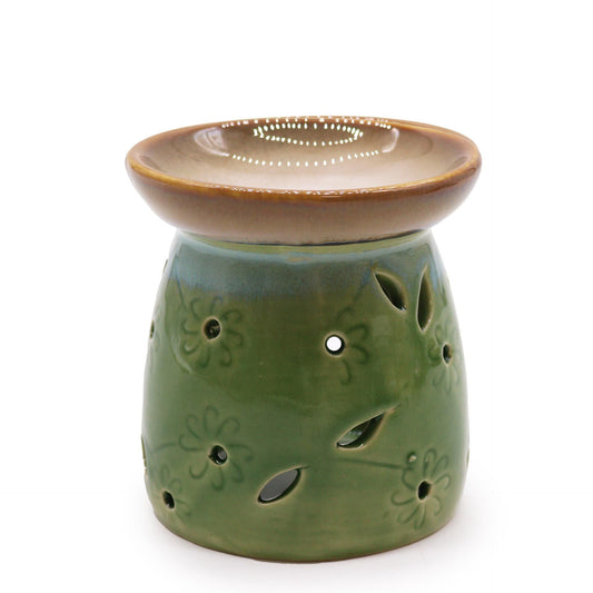 Traditional ceramic oil burner in a classic mossy green glaze with a deep bowl for fragrance oils.