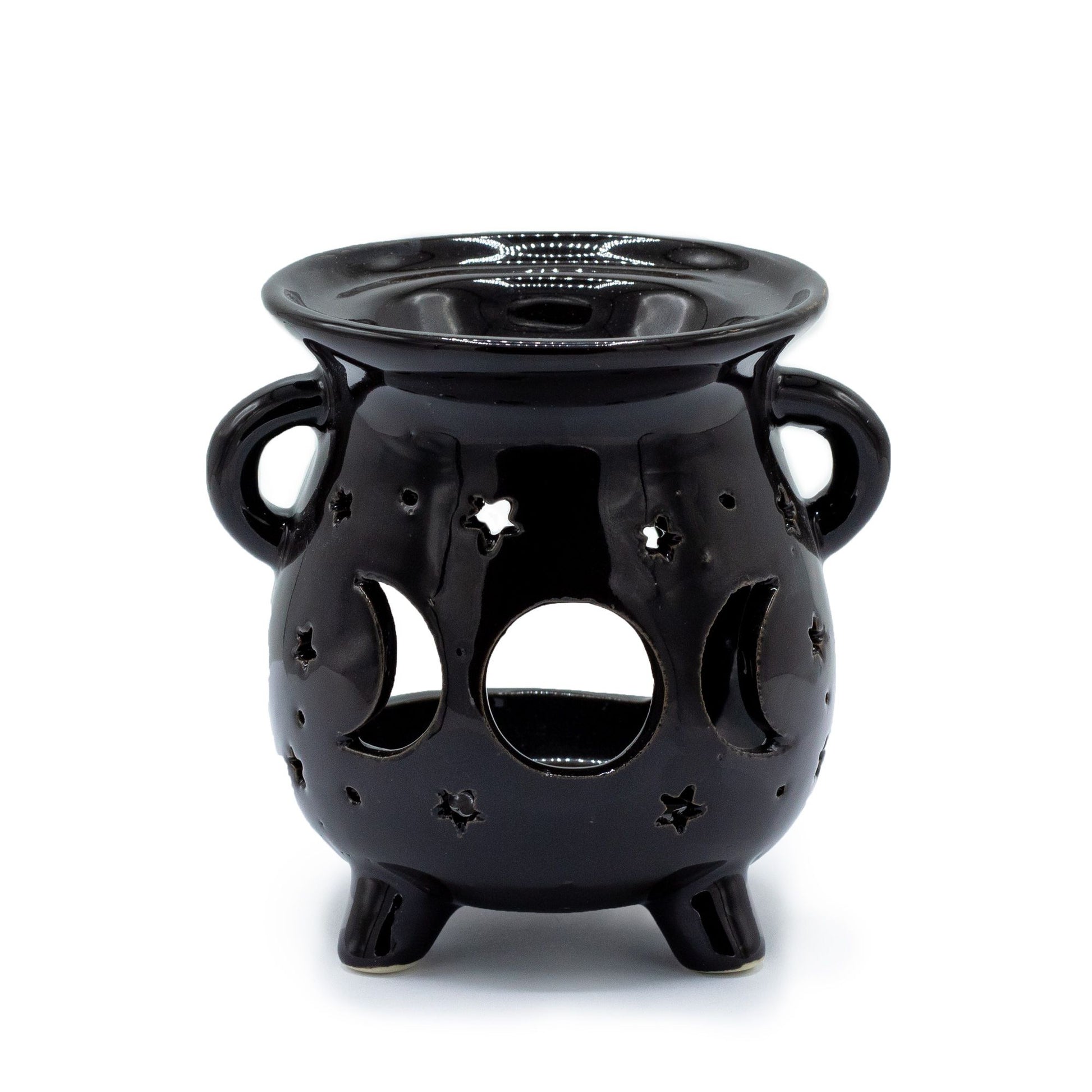 Matte black ceramic cauldron-shaped oil burner featuring carved moon phase cut-outs on the side.