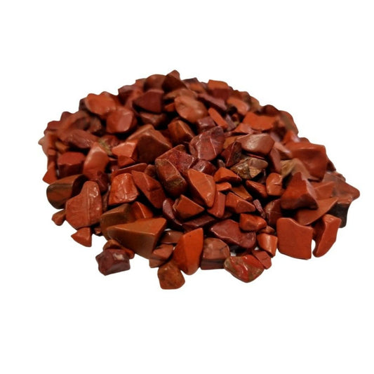 A large pile of small, polished deep red jasper gemstone chips showing natural variations in earthy tones.