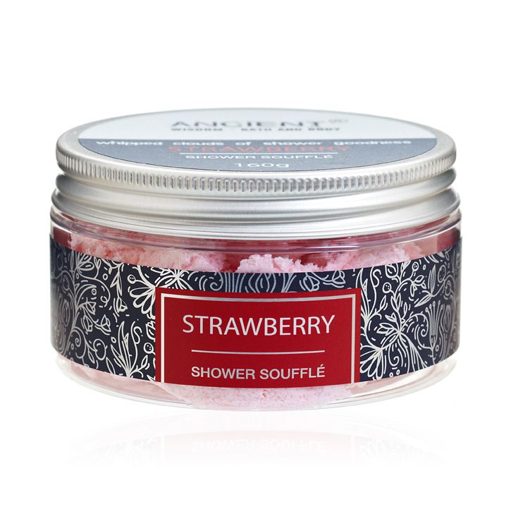 Creamy pink strawberry shower souffle in a clear tub with a light and fluffy whipped texture.