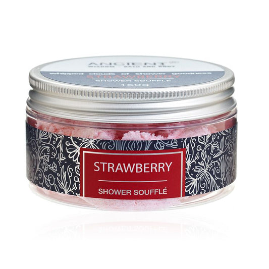 Creamy pink strawberry shower souffle in a clear tub with a light and fluffy whipped texture.