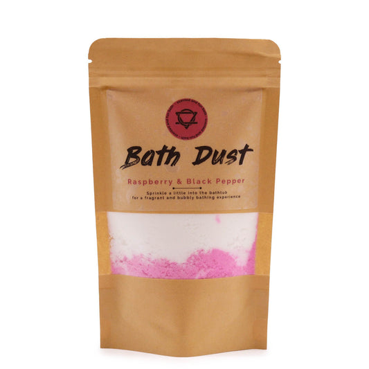 Pink and white speckled bath dust powder in a clear glass jar with a metal lid.